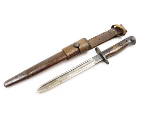 A bayonet, in leather scabbard, the blade numbered 1907, 39cm long. 