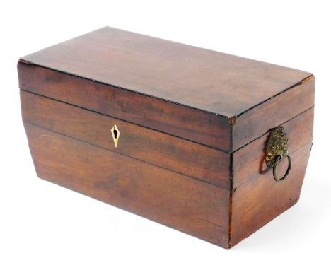 An early 19thC mahogany tea caddy, with two metal lion mask handles and a ivory key hole, lacking interior, 31cm wide, 15cm h