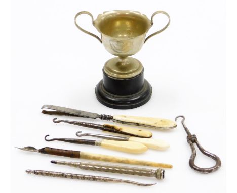 A silver plated GMS trophy cup, dated August 2nd 1937, and various silver plated and bone handled button hooks, together with