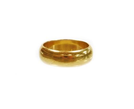 An 18ct gold wedding band, of plain design, hallmarks rubbed, ring size J½, 5.8g all in. 