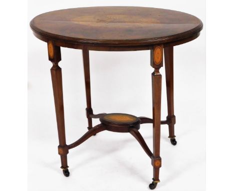 An Edwardian parquetry and mahogany Sheraton revival inlaid sofa table, the oval top with large shell parquetry inlay, on tap