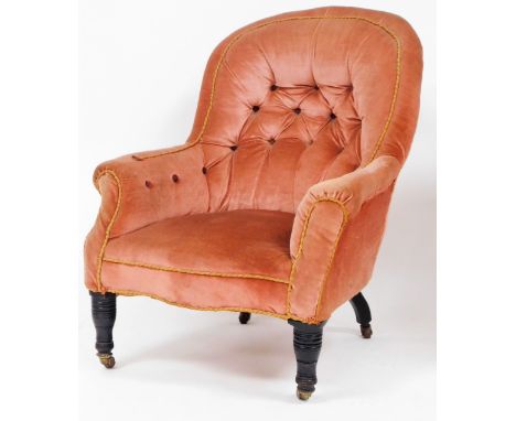 An Edwardian button back chair, in pink upholstered material with button back and corded banding on turned mahogany legs with