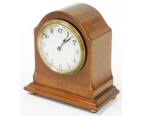 An Edwardian mahogany&nbsp; mantel clock, with a marquetry banded scroll border, on brass bun feet, with Buren Swiss wind up 
