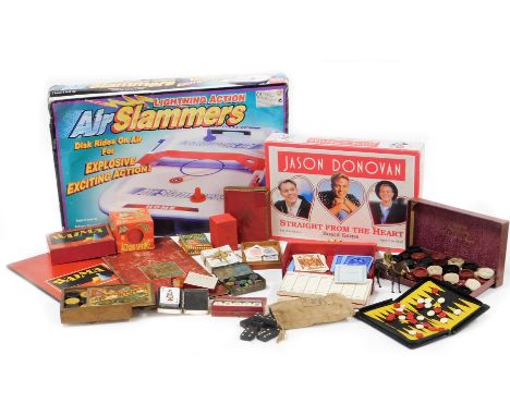 A group of games and trinkets, to include Lightening Action Air Slammers, Jason Donovan Straight from the Heart, Hula Hoops A