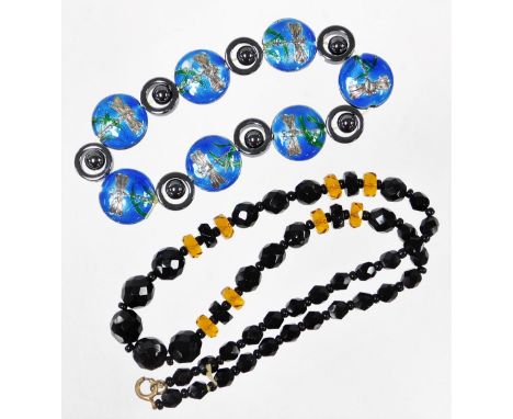 Two items of jewellery, to include a jet beaded necklace and an enamel dragonfly bracelet, the necklace on a gold plated clas