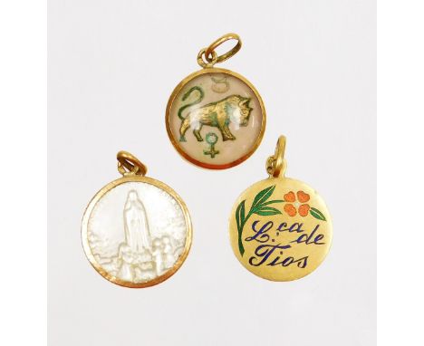 Three circular pendants, to include a gold framed bull pendant, a gold and enamel floral pendant and a mother of pearl and go