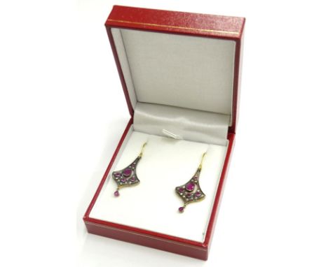 A pair of diamond and ruby Art Nouveau style drop earrings, each of flared design, set with old cut diamonds and oval cut rub