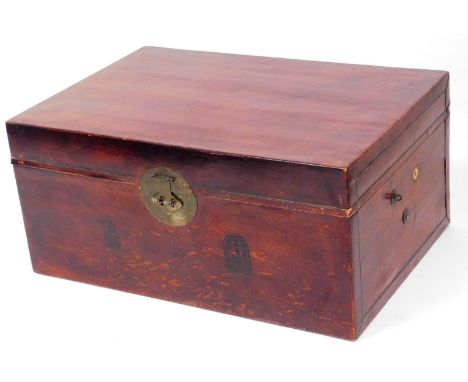 An oriental trunk, with redwood lacquering and brass back plate, with two Chinese emblems to front and two metal carry handle