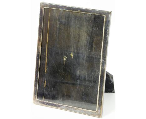 A 20thC photograph frame, of plain rectangular form with ebonised oak easel back, marked P. PAT25474, white metal, unmarked, 