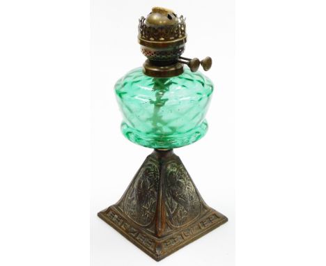A Victorian aesthetic oil lamp base, the green glass reservoir on a square tapered metal base with panels of birds and flower