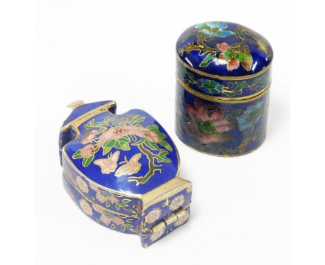 Two oriental cloisonné trinket boxes, the oval example with blue enamel cloisonné decoration on brass, depicting pink and blu