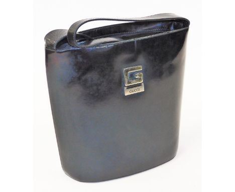 A vintage 1980's ladies handbag, in black leather, with Gucci label and interior, 29cm high, 30cm wide.