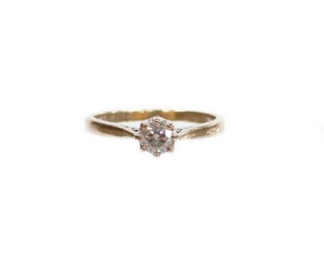 An 18ct white gold diamond solitaire ring, set with a round brilliant cut diamond measuring 0.33 carats, with pierced shoulde