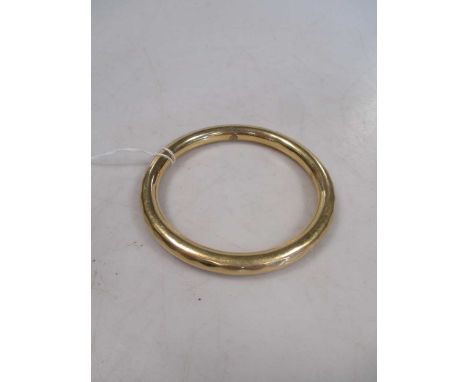A slave bangle, tests to 18ct 30.7g
