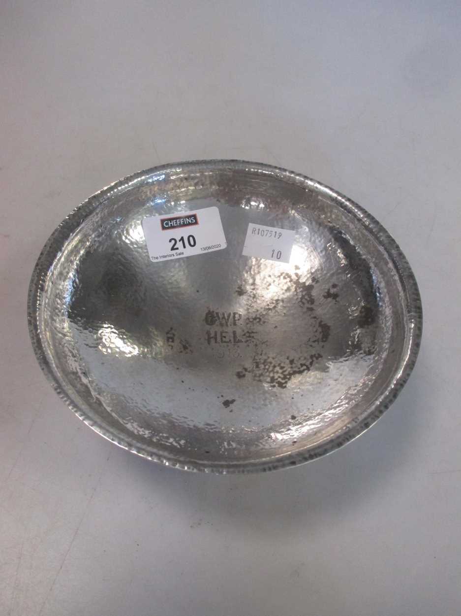 A white metal hammered bowl, tests as silver 7.8ozt in Cheffins Fine Art