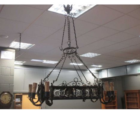 A wrought iron hanging chandelier