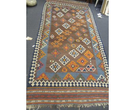 A Causcasian kelim carpet with geometric design