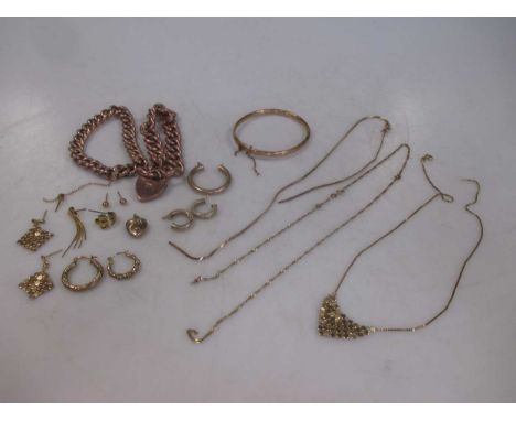 Two 'charm' style bracelets marked '9ct' together with a quantity of scrap 9ct gold and a bangle, 70.8g gross