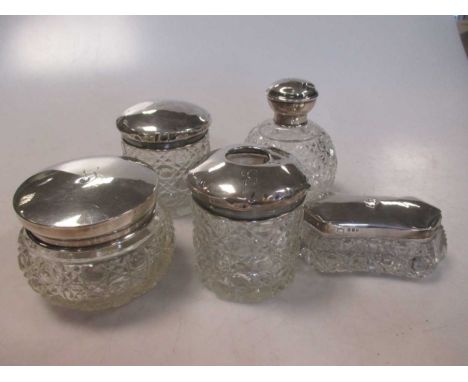 A collection of 5 silver topped glass dressing table jars (5)