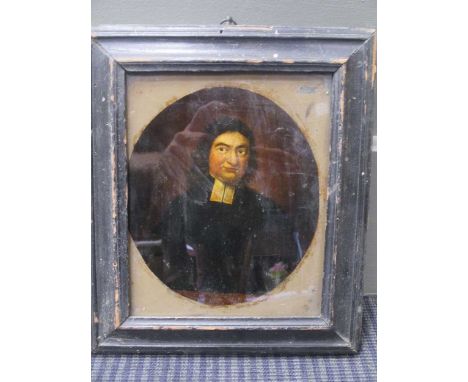An 18th century reverse print on glass of a cleric