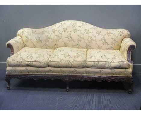 A carved frame camel back sofa, early 20th century, re-upholstered, c.197cm wide