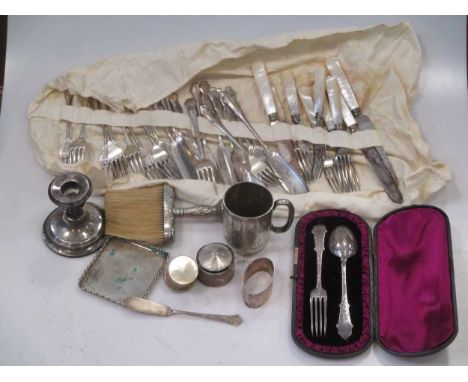 A small assortment of silver, including a Victorian spoon and fork, four Victorian fiddle pattern dessert spoons, a christeni