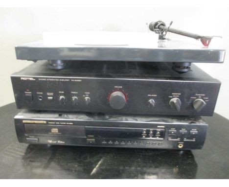 A Rotel amplifier, CD player by Marantz, and turntable Pro-ject 1-Xpression