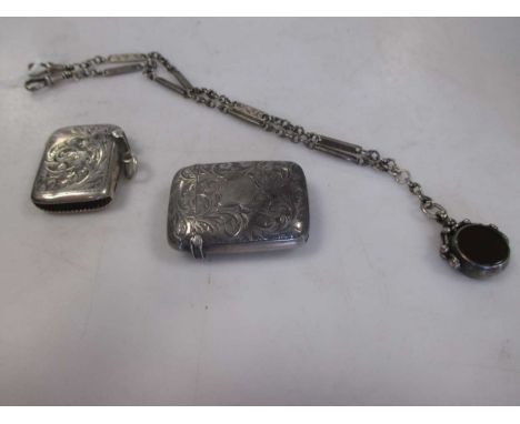 Two silver vesta cases together with a pocket watch chain and fob (3)