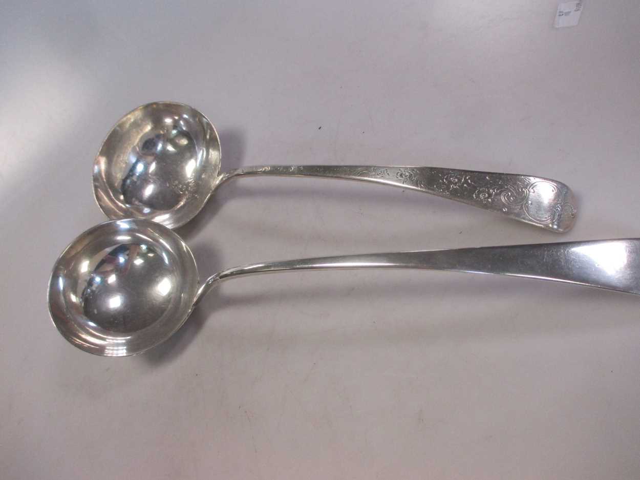 Two silver soup ladles, one with probably later decoration, 11