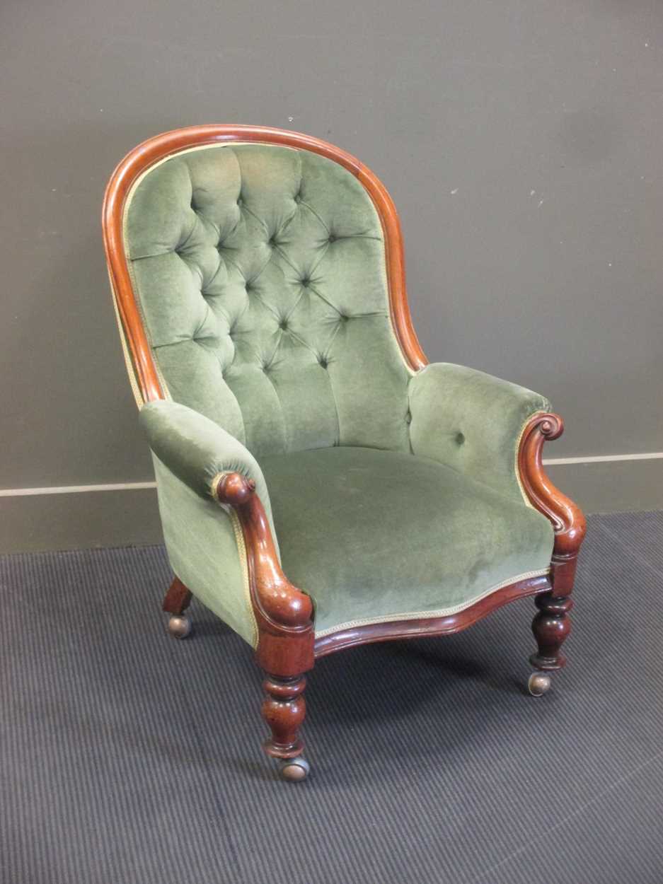 A Victorian walnut nursing chair, with buttoned back and stuffed over