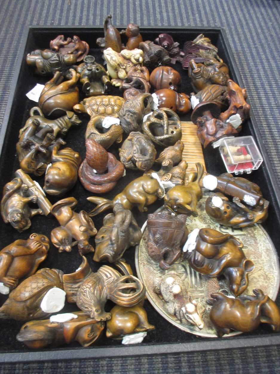 A collection of modern Japanese carved netsuke in Cheffins Fine Art