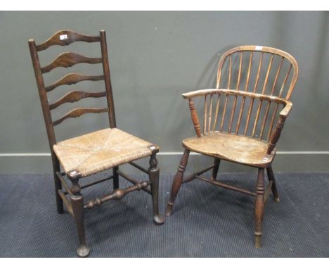A 19th century elm Windsor armchair and an ash ladder back chair (2)