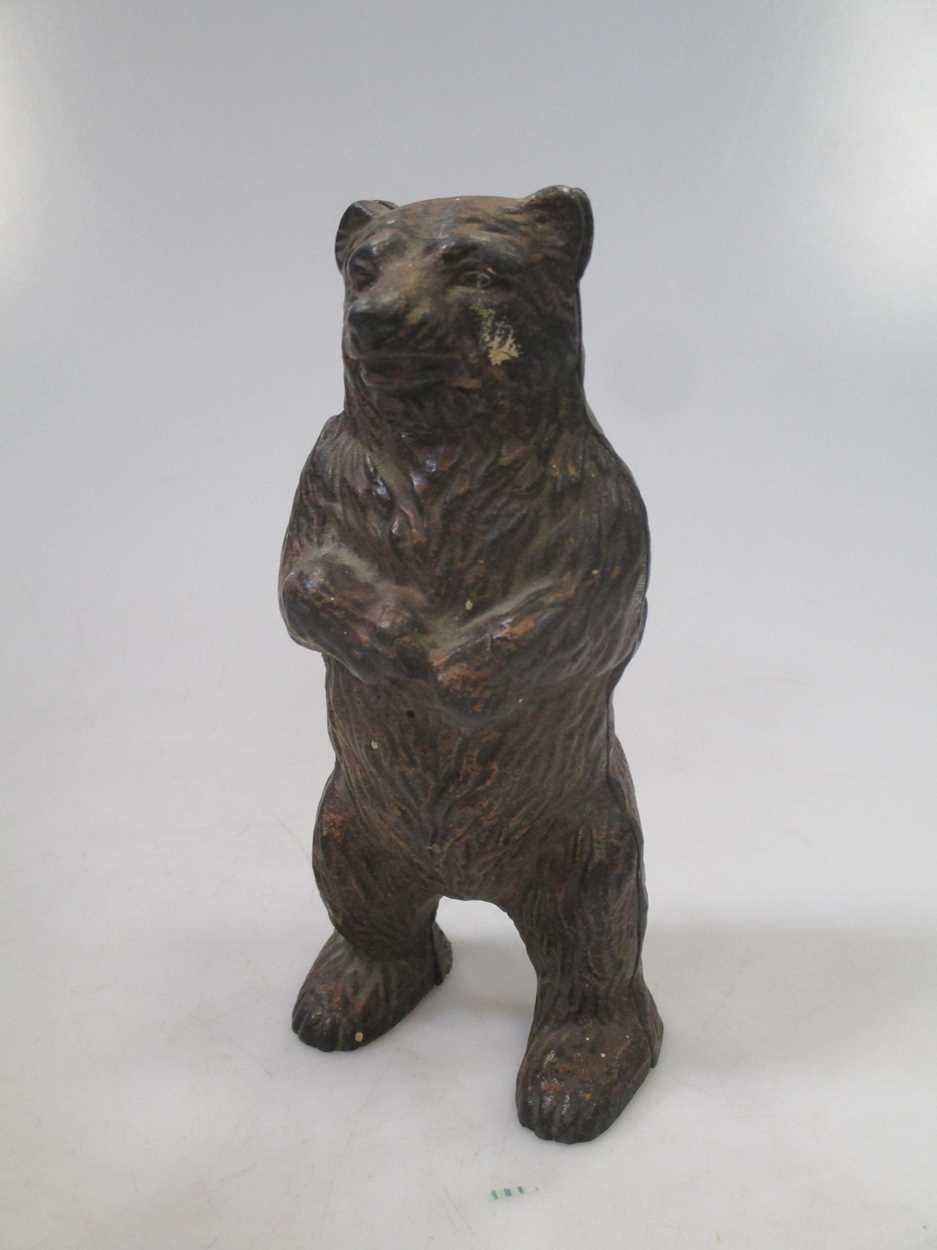 A bear money box in Cheffins Fine Art