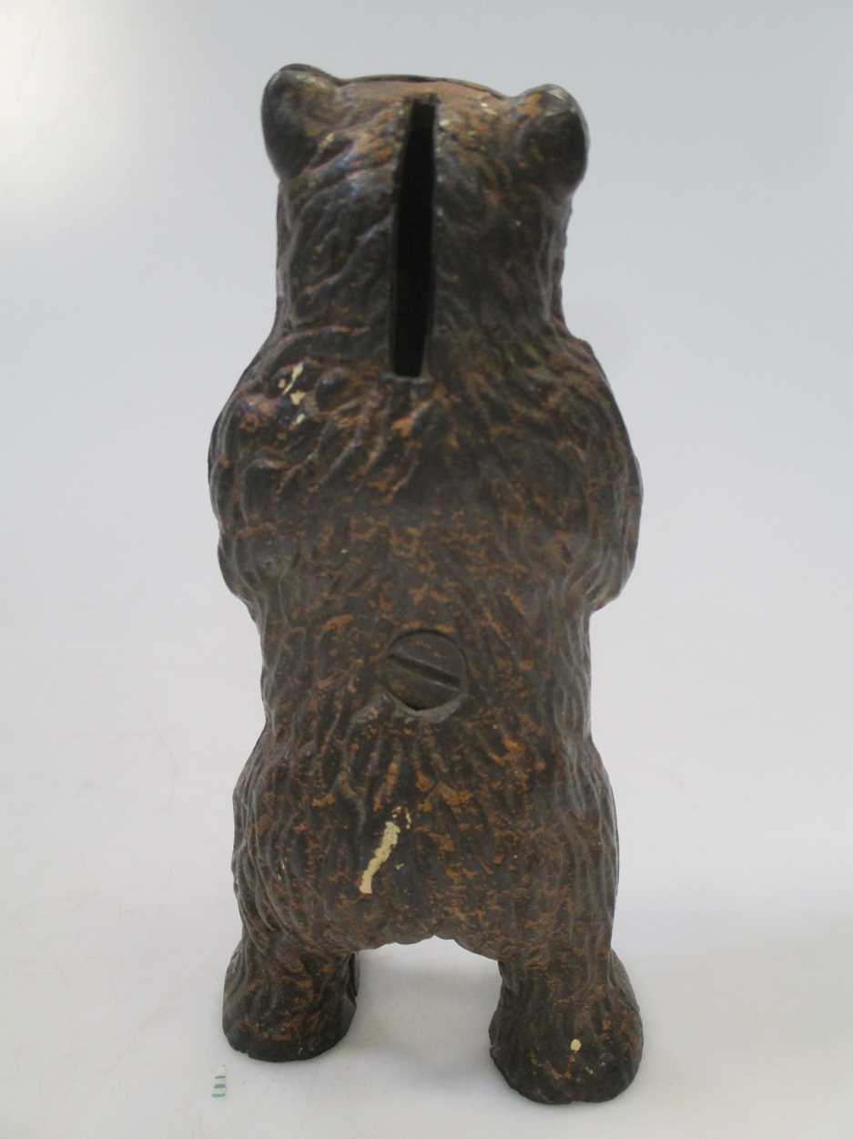 A bear money box in Cheffins Fine Art