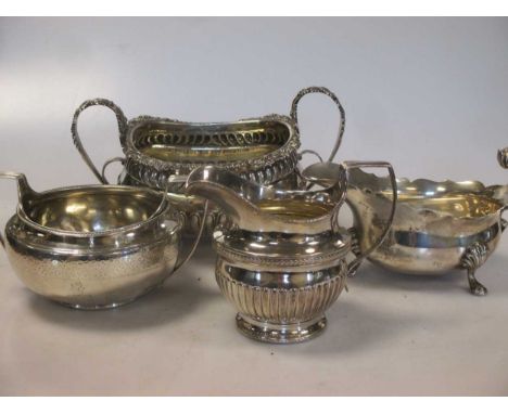 Two silver sugar bowls, a silver cream jug and a silver sauce boat, 35ozt gross (4)