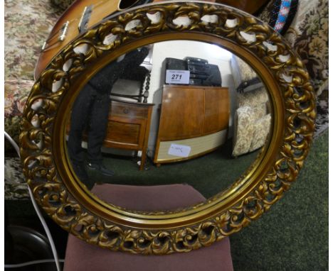 A mahogany standard lamp, upholstered stool and a gilt wooden framed pierced circular wall mirror 