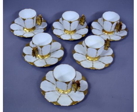 Aynsley, a set of six gilt teacups and saucers, each cup having a handle in the form of a butterfly CONDITION REPORT; Two cup