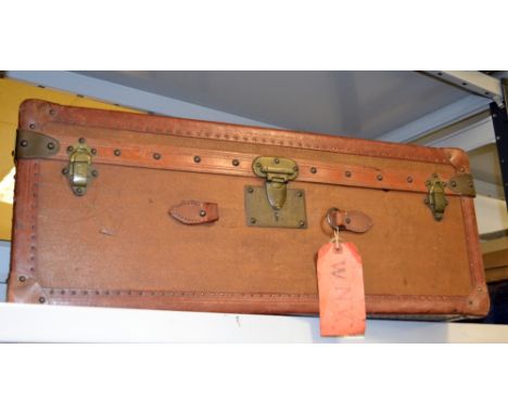 A vintage travel trunk and contents