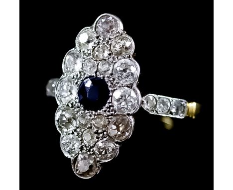 A Sapphire and Diamond Ring, Early 20th Century, in 18ct gold mount, the oval face set with central sapphire, approximate wei