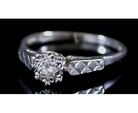 A Diamond Ring, 20th Century, in 18ct white gold mount, the centre set with a round brilliant cut diamond, approximate weight