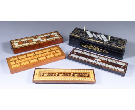 An Ebonised and Mother-of-Pearl Inlaid Cribbage Board/Box, 19th Century, the lid lifting to reveal a sectional interior for c