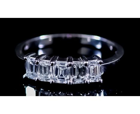 A Five Stone Diamond Ring, Modern, in 18ct white gold mount set with five baguette cut diamonds, approximate total diamond we