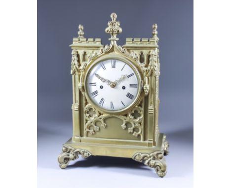 An Early 19th Century Cast Brass Gothic Pattern Cased Mantel Clock, the 5ins diameter silvered dial with Roman numerals, to t