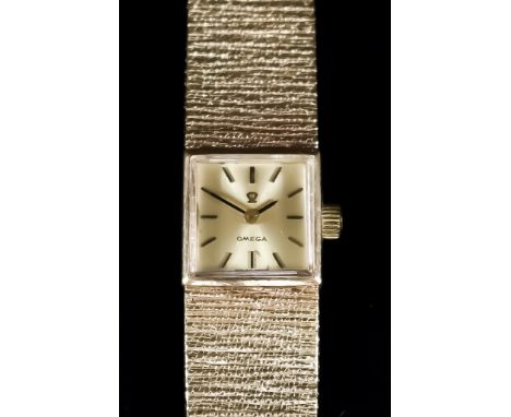 An Omega Lady's Cocktail Watch, 20th Century, 9ct Gold Cased, the champagne dial with gold baton numerals, 14mm square case, 