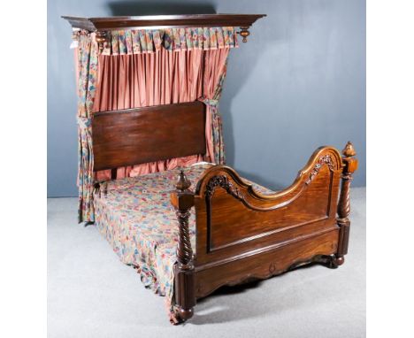 A Victorian Mahogany 4ft 6ins Half Tester Bedstead, with deep moulded cornice, shaped and moulded end board with bold spiral 