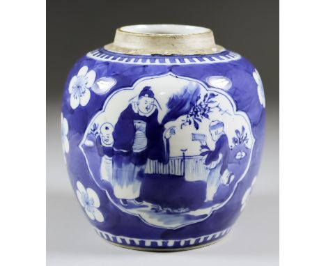 A Chinese Blue and White Porcelain Jar, painted with figures in two shaped reserve panels on a cracked ice ground with prunus