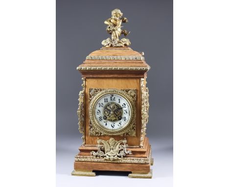 A Late 19th Century French Oak and Brass Mounted Mantel Clock, by G. V., No. 1761 48, the 3.5ins diameter white enamel chapte