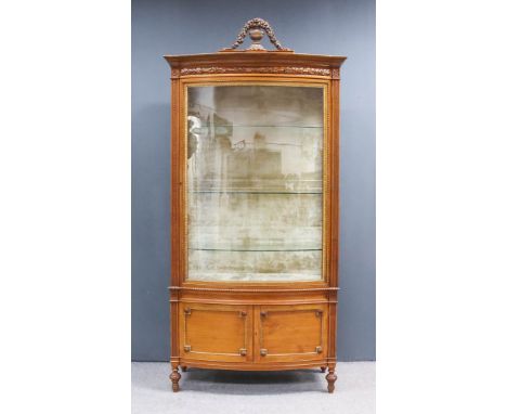 A Late 19th/Early 20th Century French Satinwood and Parcel Gilt Bow Front Display Cabinet of "Louis XVI" Design, from Maple &