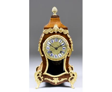 An Early 20th Century French Walnut and Gilt Brass Mounted Mantel Clock of "Louis XV" Design, the 3.25ins diameter gilt brass