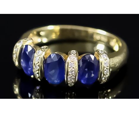 A Three Stone Sapphire Ring, Modern, in 18ct gold mount, the three sapphires, approximate total sapphire weight 1.80ct, inter